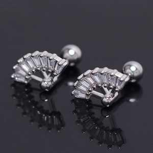 Macro view of silver fan-shaped stud earrings with T-cut zircons and ball back closure