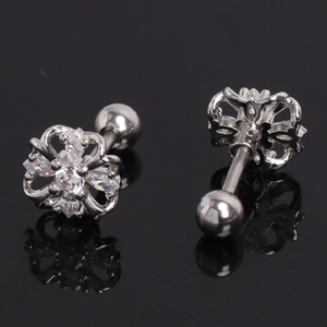 Detail of silver flower stud earrings with crystals and threaded ball back closure