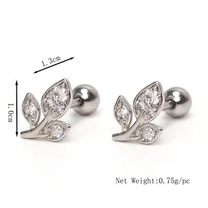 Leaf shaped stainless steel stud earrings with clear zircon stones on white background