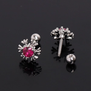 Sparkling snowflake stud earrings with ruby red zircon in polished silver steel setting