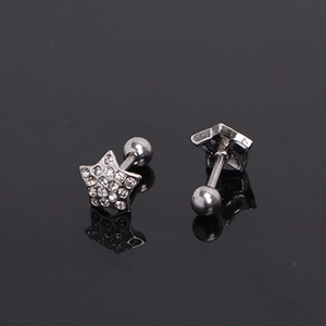 Sparkling star stud earrings with silver metal and clear crystals on black surface
