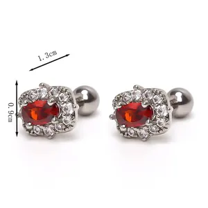 Elegant oval red ruby earrings with sparkling crystal halo in polished stainless steel