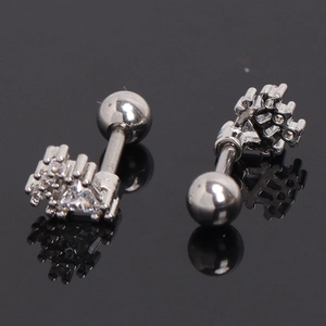 Silver crown barbell ear stud with clear zirconia inlay and screw ball back on black surface