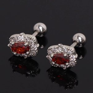 Polished stainless steel stud earrings with oval ruby zircon and white crystal halo