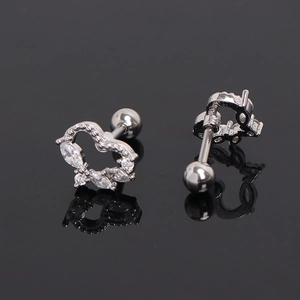Silver heart earrings with marquise cubic zirconia stones and ball screw backs on grey surface