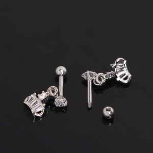 Polished stainless steel crown earrings with white zircon stones on black background