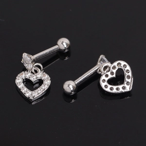 Polished heart-shaped stud earrings with sparkling cubic zirconia on a dark surface