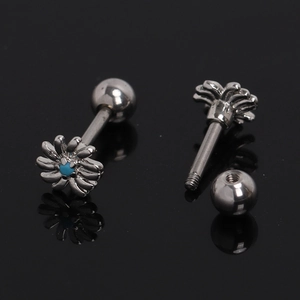 Macro detail of daisy flower screw back earrings with turquoise blue stone inlays