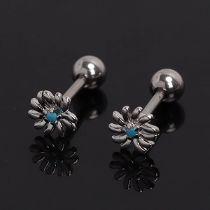Macro view of daisy barbell earrings with blue center bead and screw back closure