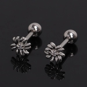 Macro detail of daisy stud earrings with clear crystal centers and secure screw backs