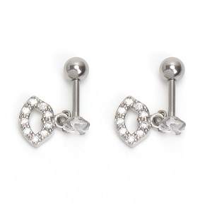 Detail of silver lip stud earrings with cubic zirconia and pear-cut drop stones