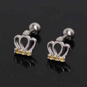 Macro detail of crown stud earrings with sparkling yellow zircons and screw back
