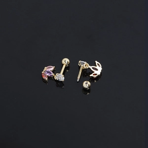 Detail of gold clover stud earrings with marquise-cut zircons and screw ball back closure