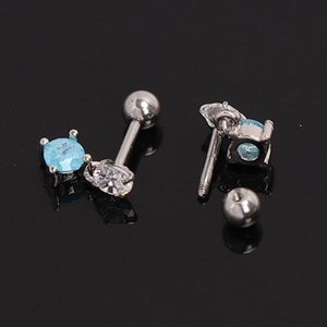 Detail of blue and white sapphire stud earrings with screw back design in stainless steel