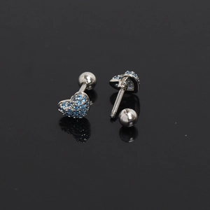Detail of heart-shaped screw back earring with sparkling blue cubic zirconia stones