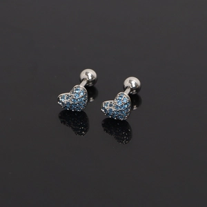 Macro shot of heart-shaped stainless steel studs with blue pavé zircon and ball backs