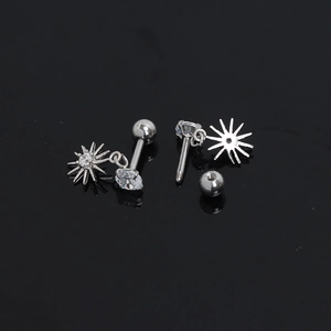 Silver stainless steel eight-pointed star earrings with clear zircon stones on black background