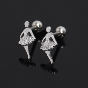 Macro shot of ballet dancer stud earrings with white zircons on a black mirror surface