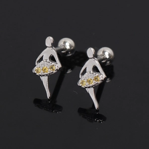 Macro detail of silver ballet girl earrings featuring yellow cubic zirconia and screw backs