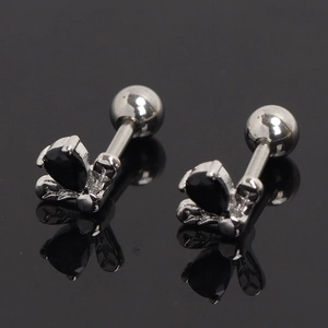 Detailed view of silver butterfly screw back earrings with drop-shaped black gemstones