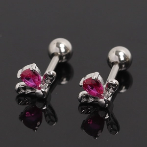 Macro detail of rose flower stud earrings with pink pear-shaped cubic zirconia crystals