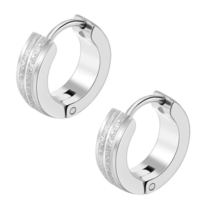 Detailed close-up of silver titanium steel earrings with matte sandblasted texture