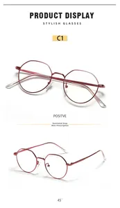 Detail of gunmetal round metal frame glasses showing sleek design and flat lenses