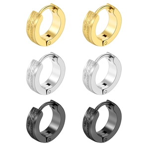 Three pairs of matte and polished titanium steel hoop earrings in gold, silver, and black