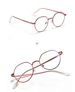 Macro detail of rose gold small round metal frame sunglasses from a 45-degree angle