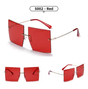 Three-view layout of red oversized rimless sunglasses with gold metal temples and rivets