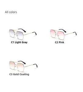 Detailed look at oversized square metal sunglasses in light grey, pink, and gold lenses