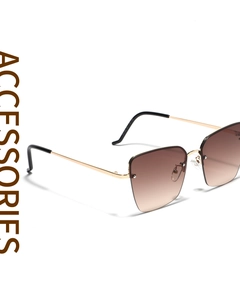 Detail of gold metal temples and brown gradient lenses on square semi-rimless sunglasses