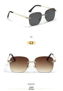 Detail of rimless square sunglasses with gold metal frame and rhinestone accents