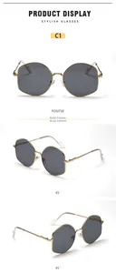Detailed views of gold polygonal metal frame sunglasses with gray tinted lenses
