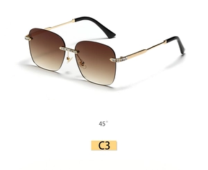Detail of rimless square sunglasses with gold metal bridge and sparkling rhinestone accents