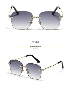 Detail of rimless square sunglasses with gold metal frame and gradient gray-pink lenses
