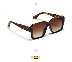 Detailed 45-degree view of square tortoiseshell sunglasses with brown gradient lenses