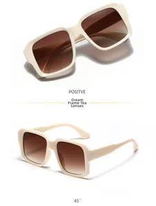 Detailed view of beige square frame sunglasses with tea-colored gradient resin lenses