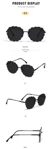 Close-up of rimless cloud sunglasses with grey wave petal edges and black metal temples