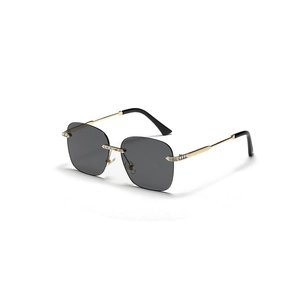 Rimless square gold metal sunglasses with diamond-studded bridge and dark grey lenses