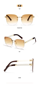 Detailed views of rimless cat-eye sunglasses with gold chain bridge and brown lenses