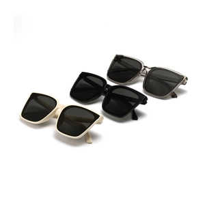 Retro square oversized sunglasses in black, cream, and grey with silver rivet details