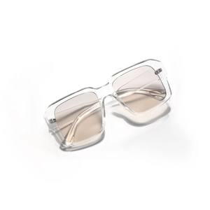 Modern oversized square sunglasses with transparent frames and light brown tinted lenses
