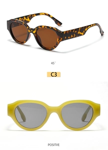 Detail view of retro oval sunglasses in tortoiseshell and translucent yellow frames