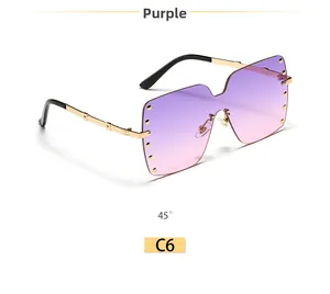 Detail of rimless square sunglasses with purple gradient lenses and gold rivet accents