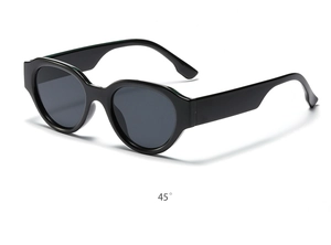 Detail view of oval cat-eye sunglasses featuring thick black frames at a 45-degree angle