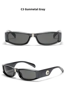 Detail view of gunmetal grey rectangular punk sunglasses with silver bridge and metallic holes
