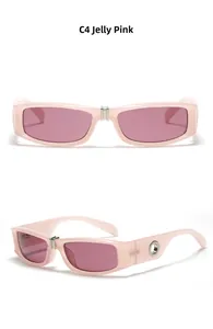 Detail view of jelly pink rectangular sunglasses with punk Y2K style and side metal rivets