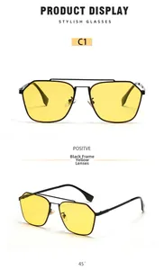 Detail of yellow aviator lenses and double bridge black metal frames for sunglasses