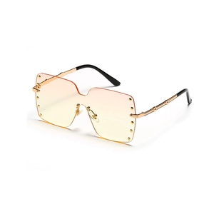 Oversized rimless square sunglasses with gradient orange lenses and punk metal rivets